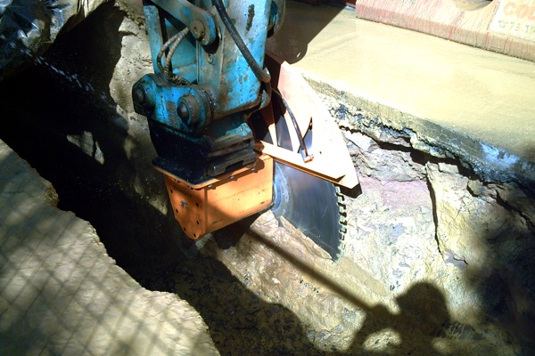 Diamond rocksaws can cut through concrete, asphalt and rock, as shown in the layers of this trench.